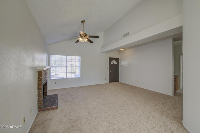 522 W Dennis Ct, Tempe, AZ 85283 - unfurnished living room with a ceiling fan, carpet flooring, high vaulted ceiling, a fireplace, and a textured ceiling