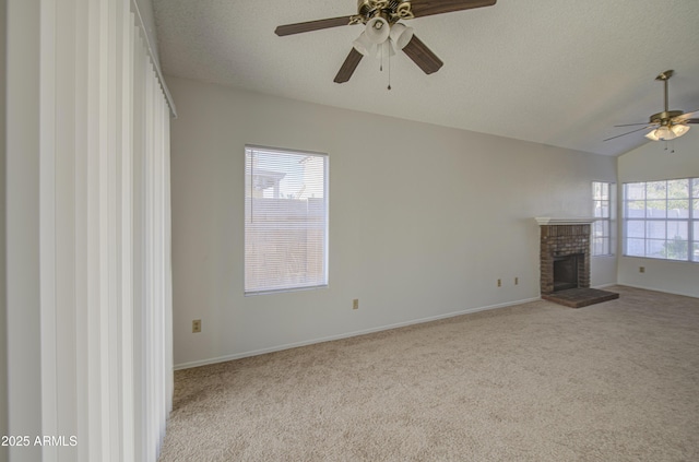 522 W Dennis Ct, Tempe, AZ 85283 - unfurnished living room with ceiling fan, a brick fireplace, carpet, a textured ceiling, and vaulted ceiling