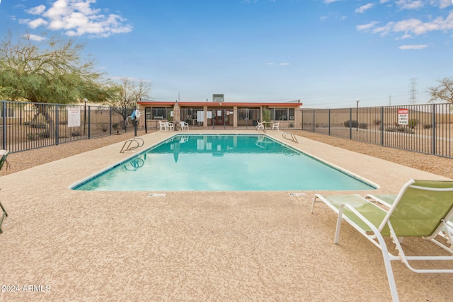 view of swimming pool with a patio area