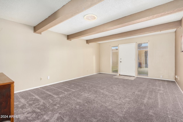 interior space featuring beamed ceiling and a textured ceiling