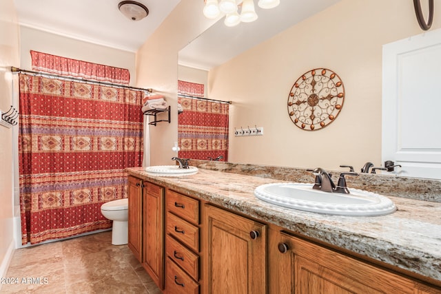 full bathroom with vanity, shower / tub combo, and toilet