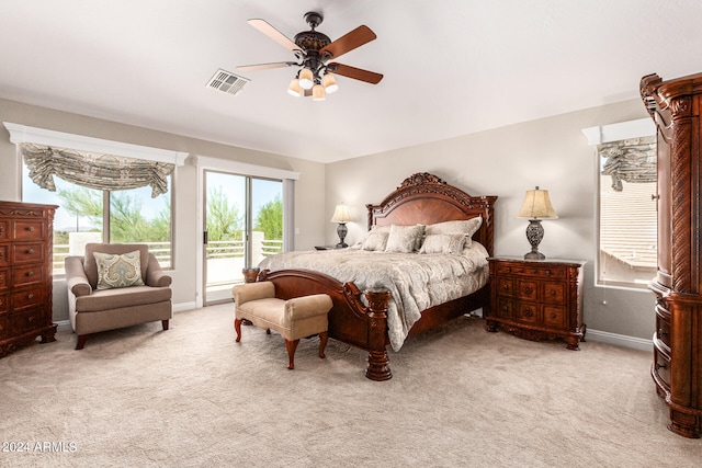 bedroom featuring ceiling fan and light carpet