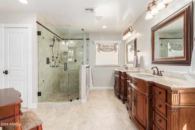 bathroom with tile patterned floors, vanity, and walk in shower