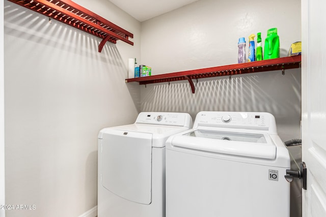 clothes washing area featuring washing machine and dryer