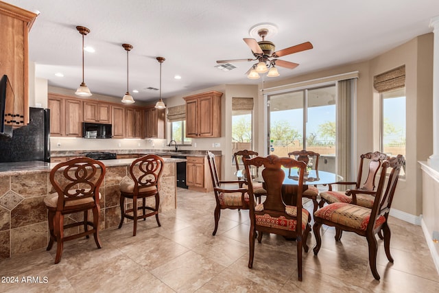 dining area with ceiling fan