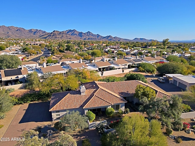 birds eye view of property with a mountain view