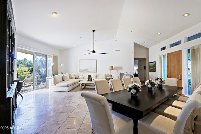 dining room featuring ceiling fan and lofted ceiling