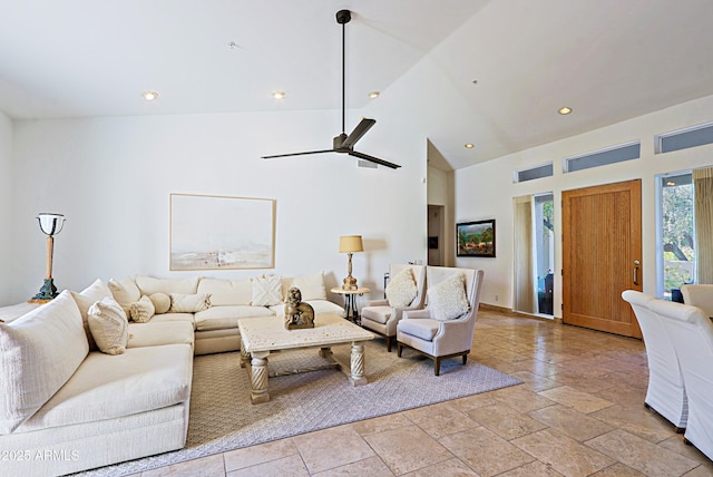 living room featuring ceiling fan and high vaulted ceiling