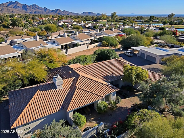 birds eye view of property featuring a mountain view