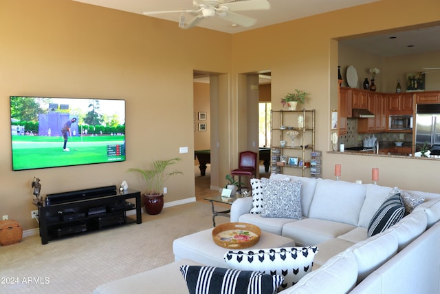 living room featuring ceiling fan and light colored carpet