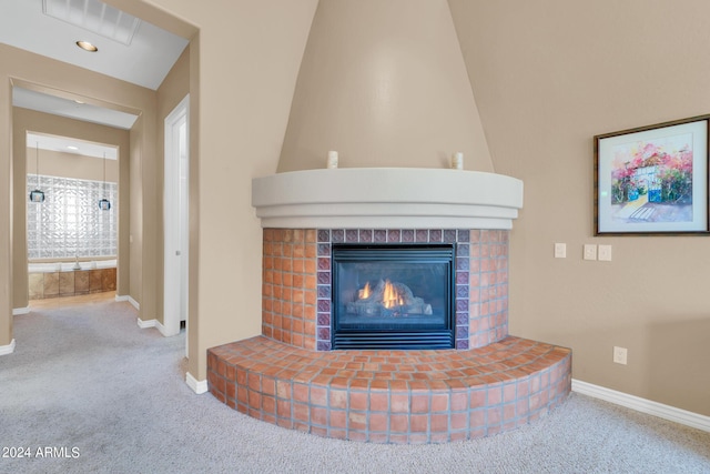 interior details featuring carpet flooring and a fireplace