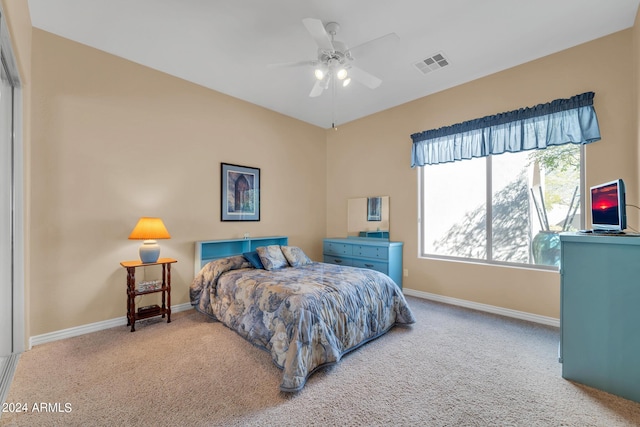 bedroom with ceiling fan and carpet