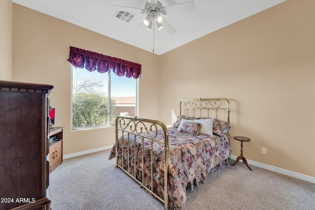 bedroom with ceiling fan and light colored carpet