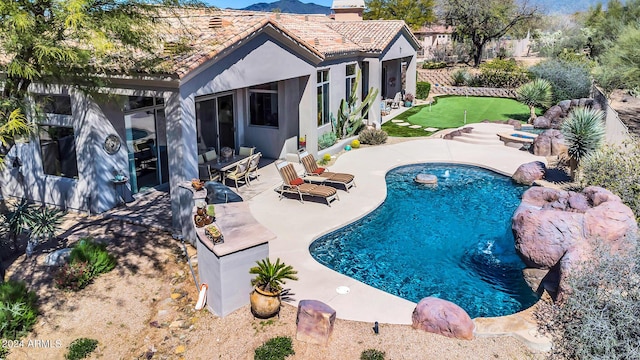 view of swimming pool featuring a patio