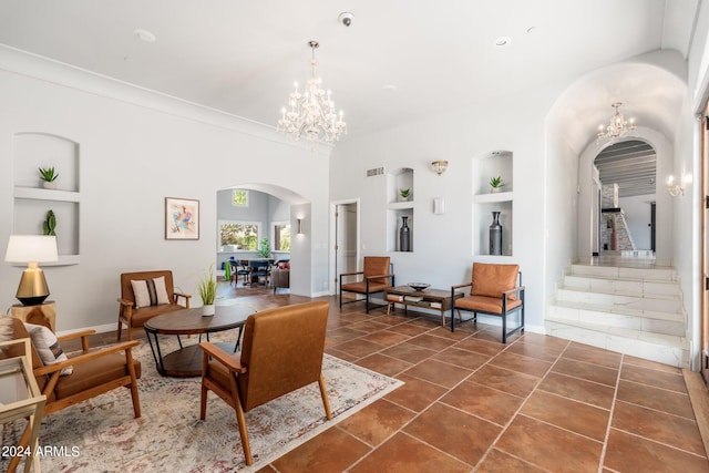 interior space featuring tile patterned flooring, a chandelier, and built in shelves