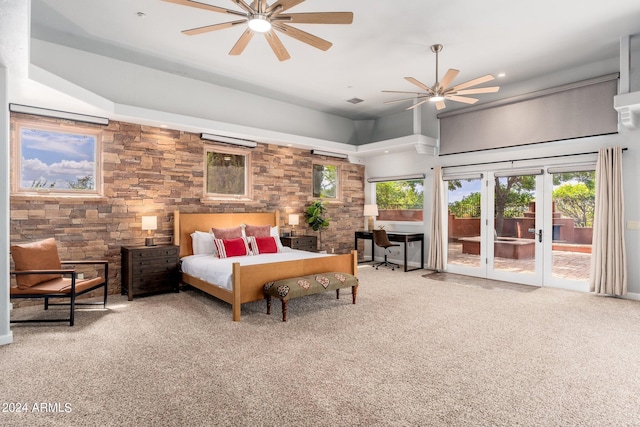 carpeted bedroom featuring ceiling fan, french doors, and access to exterior