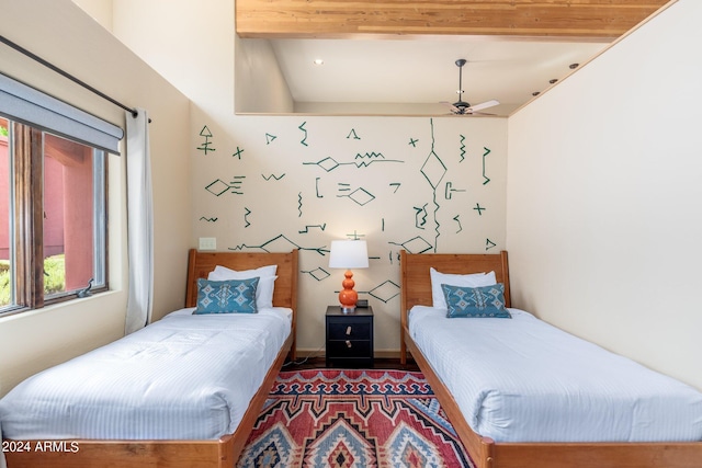 bedroom featuring lofted ceiling and hardwood / wood-style flooring