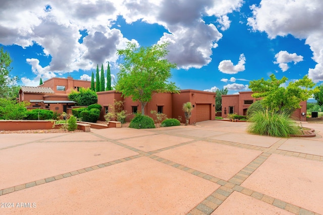 southwest-style home featuring a garage