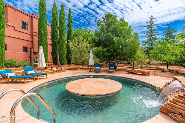 view of swimming pool with a patio