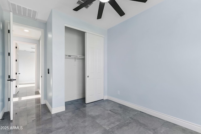 unfurnished bedroom featuring a ceiling fan, baseboards, visible vents, and a closet