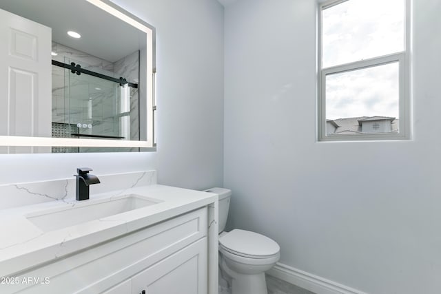 full bath with toilet, recessed lighting, vanity, baseboards, and a marble finish shower