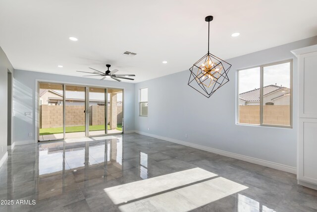 unfurnished room with recessed lighting, plenty of natural light, visible vents, and baseboards