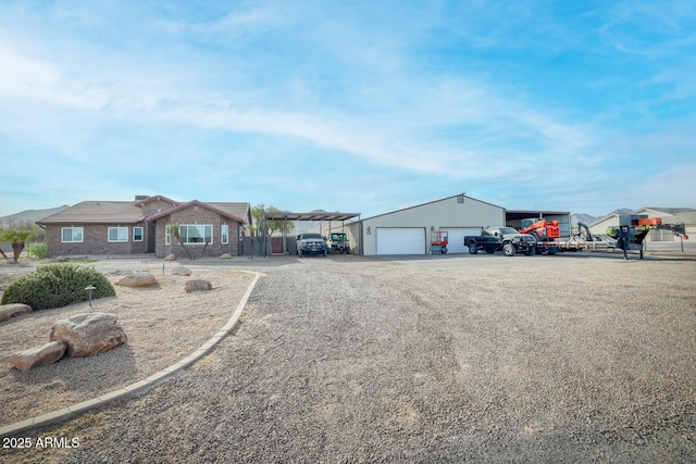 view of front of home featuring an outbuilding and a garage