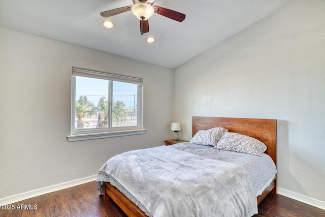 bedroom featuring ceiling fan and dark hardwood / wood-style floors