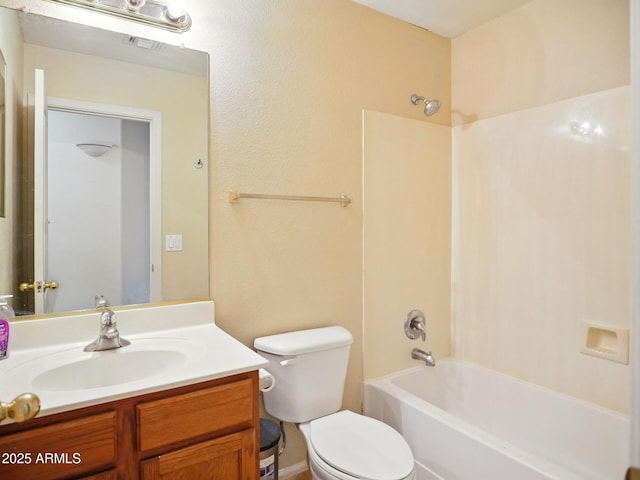 full bath with toilet, vanity, and shower / tub combination