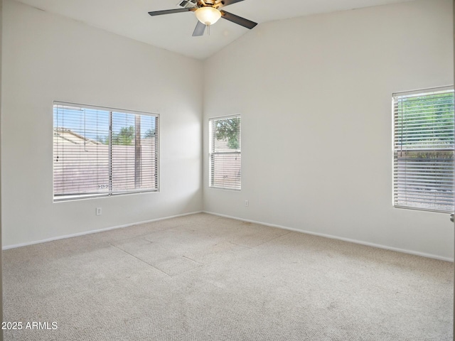 unfurnished room featuring a ceiling fan, carpet, high vaulted ceiling, and baseboards