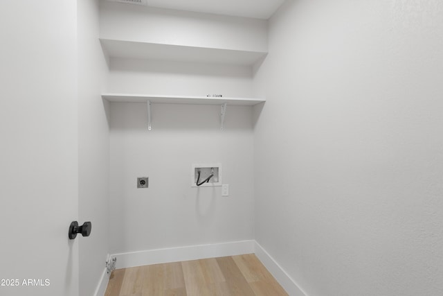 laundry area with baseboards, washer hookup, laundry area, light wood-style flooring, and hookup for an electric dryer