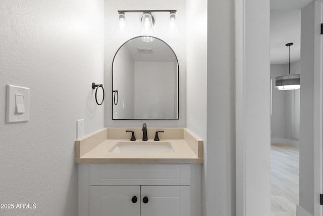 bathroom with vanity and visible vents