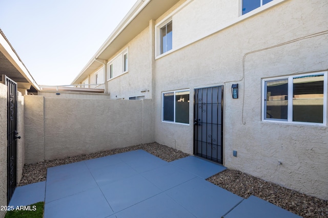 view of patio / terrace featuring fence