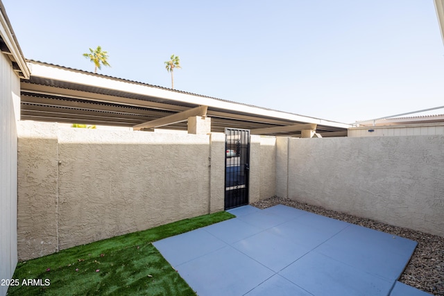 view of patio featuring a gate and fence private yard