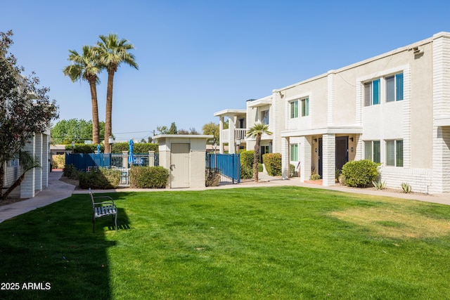 exterior space with a yard and fence