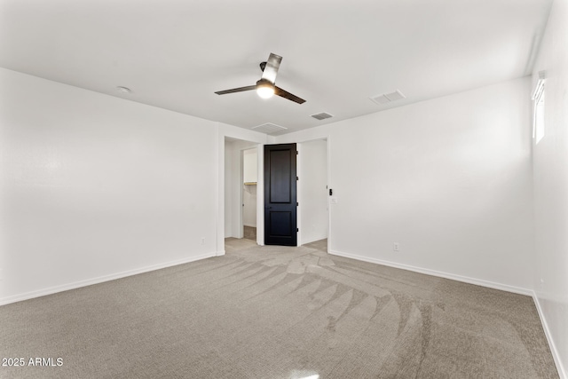 empty room featuring light carpet and ceiling fan