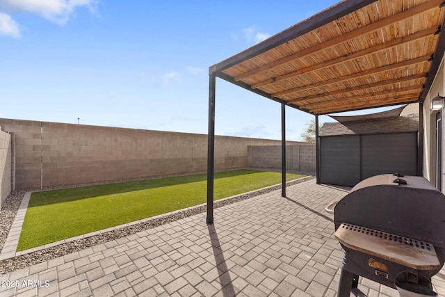 view of patio featuring a grill