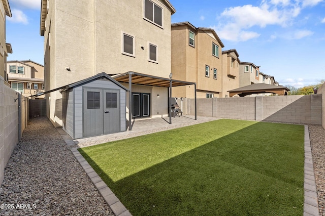 rear view of house featuring a shed, a patio, and a lawn