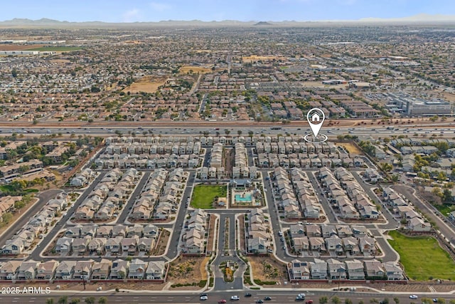 birds eye view of property with a mountain view