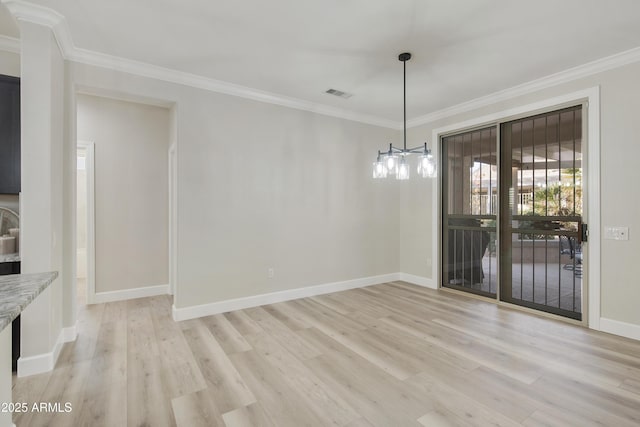 unfurnished dining area featuring light hardwood / wood-style floors and ornamental molding