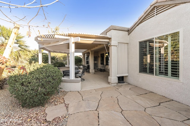 view of patio featuring a pergola