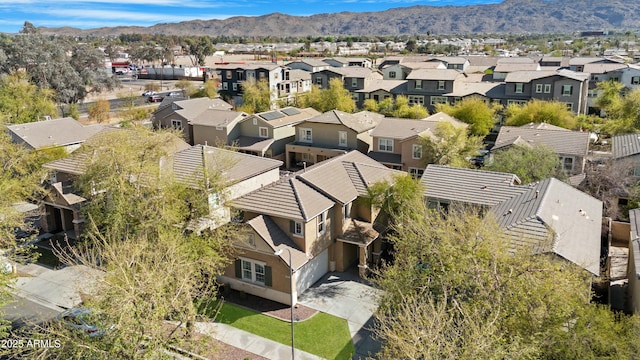 birds eye view of property featuring a mountain view and a residential view