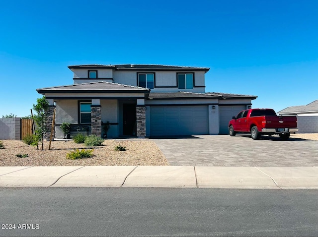 prairie-style home featuring a garage