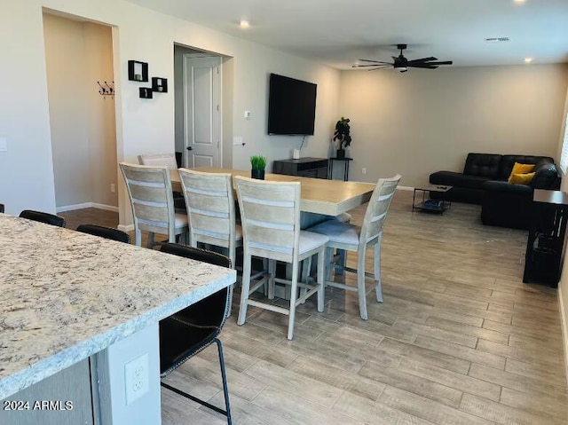 dining space with ceiling fan