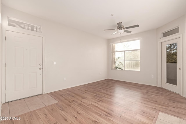 empty room featuring ceiling fan and light wood-style flooring