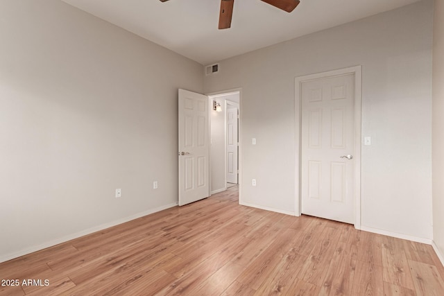 unfurnished bedroom with ceiling fan, visible vents, baseboards, and light wood-style flooring