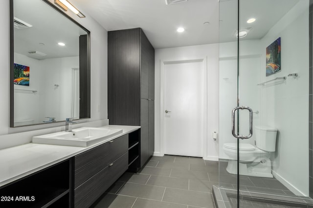 bathroom with tile patterned floors, vanity, and toilet