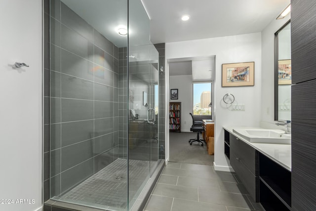 bathroom featuring tile patterned flooring, vanity, and an enclosed shower