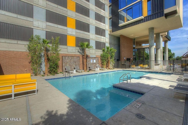 view of swimming pool with a patio