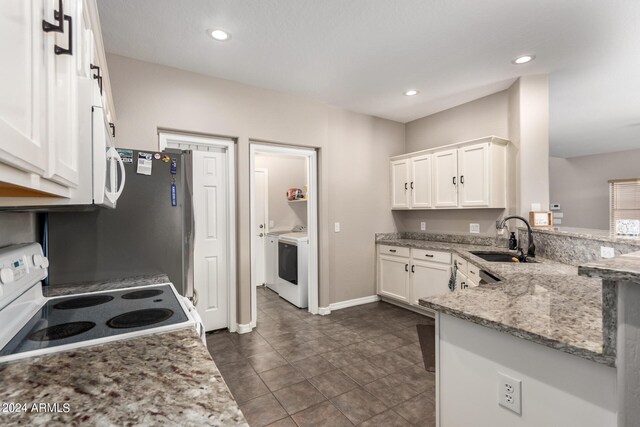 kitchen with white cabinetry, sink, electric range, light stone counters, and kitchen peninsula